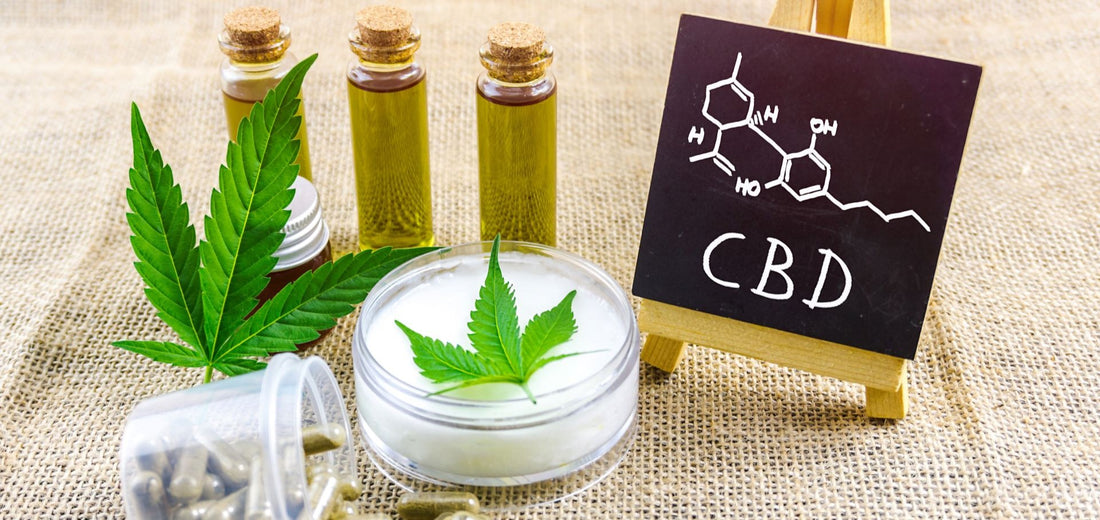 cbd oils and capsules next to cbd sign with chemical sturcture of cbd nutrient