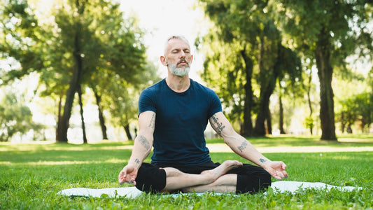 Senior man meditating to improve his mental health