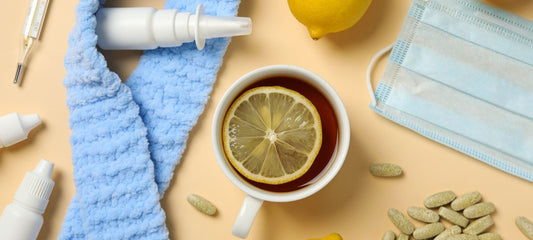 tea with lemon, pills, medical mask and bottles